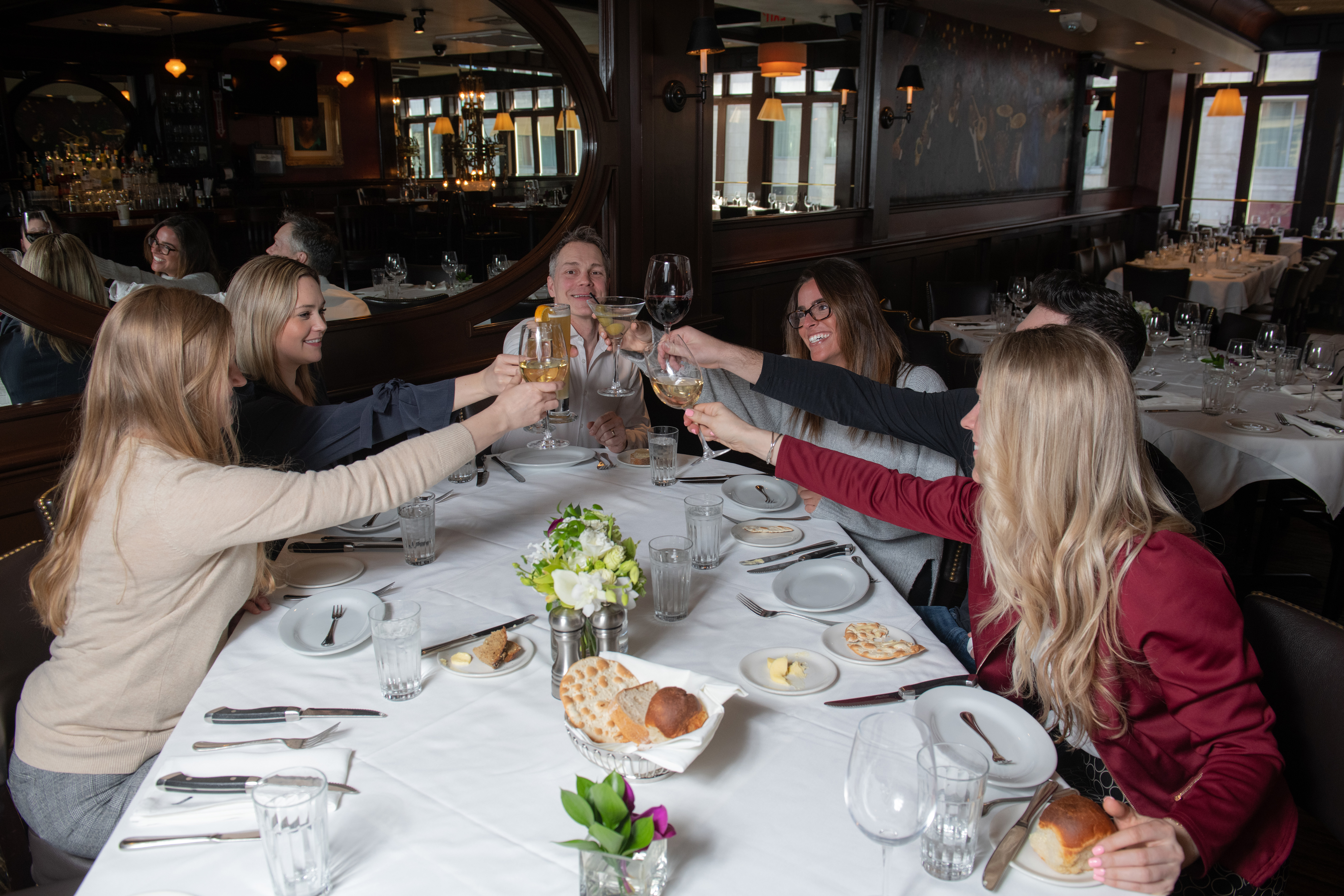 Photo of people toasting wine